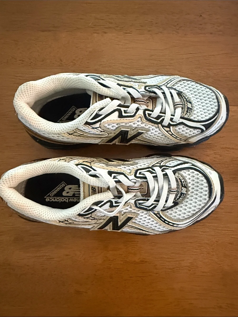 New Balance Kids White and Gold Athletic Sneakers with Black Soles